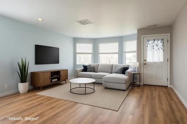 a workspace with furniture and wooden floor