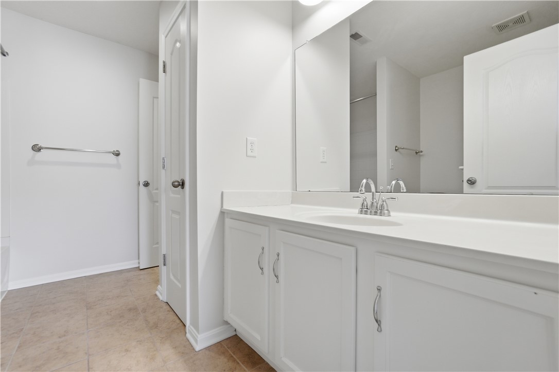 4294 Straight Arrow Road Dayton, OH 45430 - Photo 26 of 41 This bright bathroom features a vanity with ample counter space and a large mirror.
