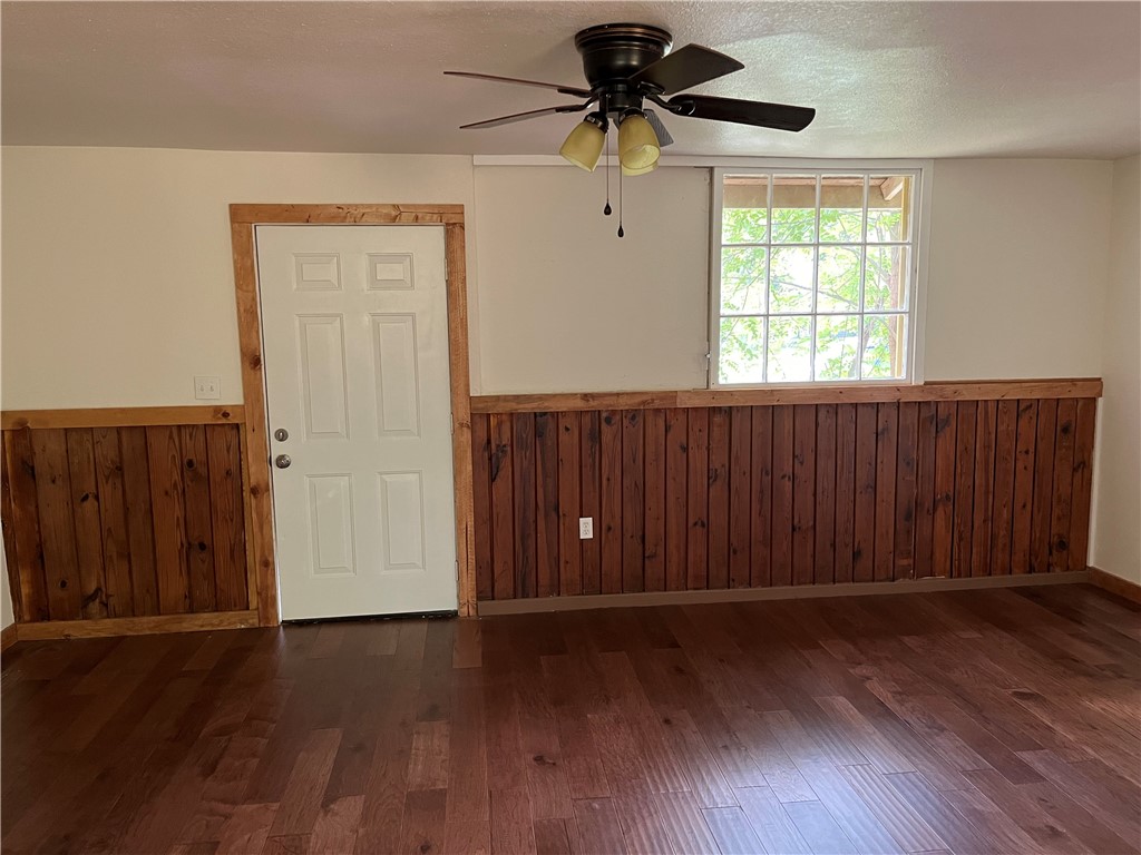 106 South Ave A, Unit E Elgin, TX 78621 - Photo 2 of 30 wooden floor in an empty room with a window