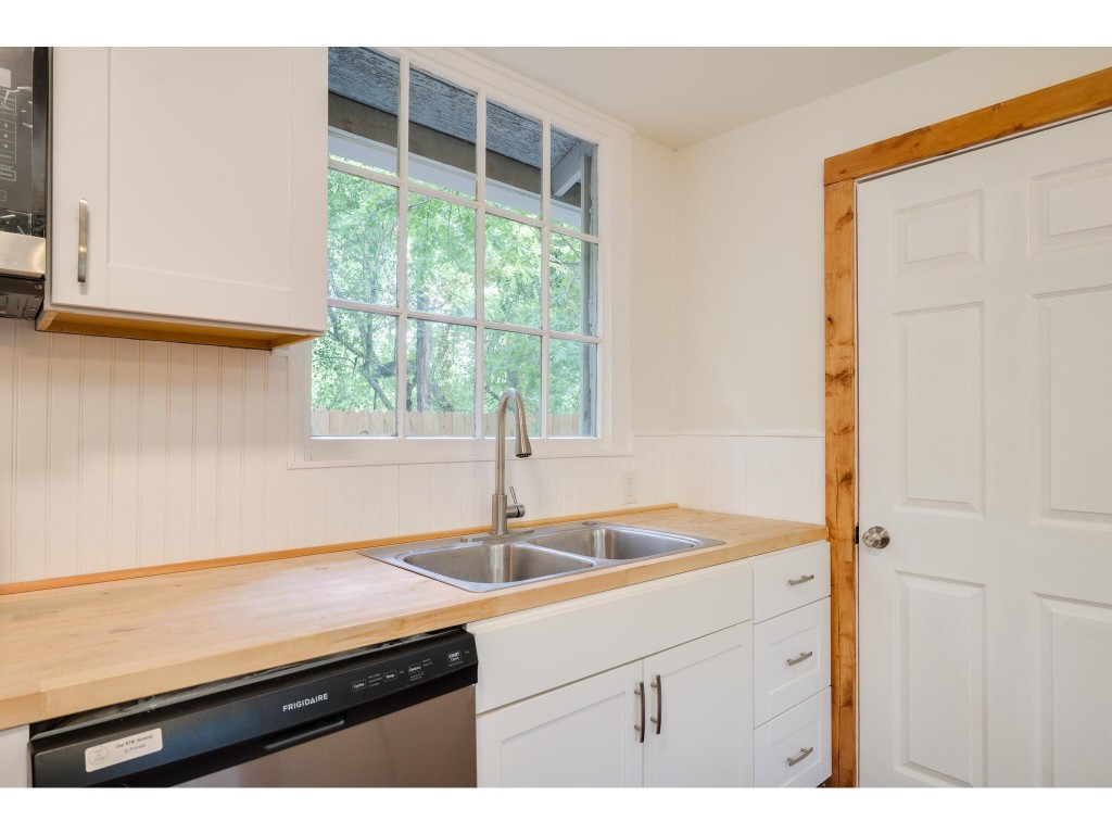 106 South Ave A, Unit E Elgin, TX 78621 - Photo 21 of 30 a kitchen with a sink and a window