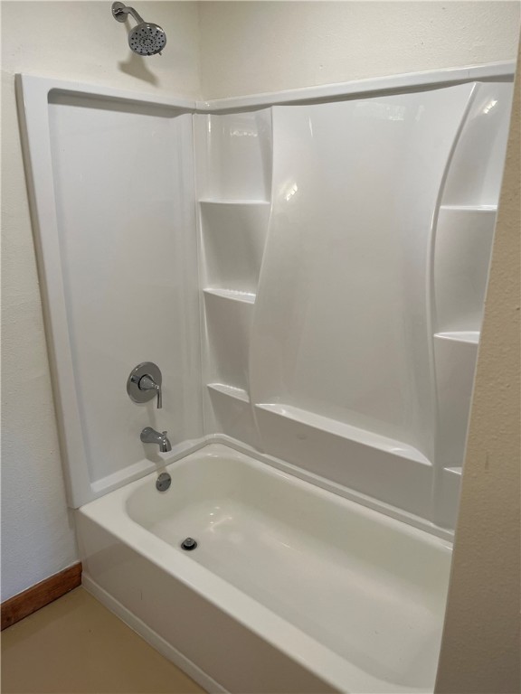 106 South Ave A, Unit E Elgin, TX 78621 - Photo 4 of 30 a bathroom with a shower and a sink