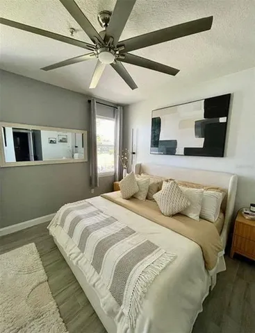 a bedroom with a large bed and a window