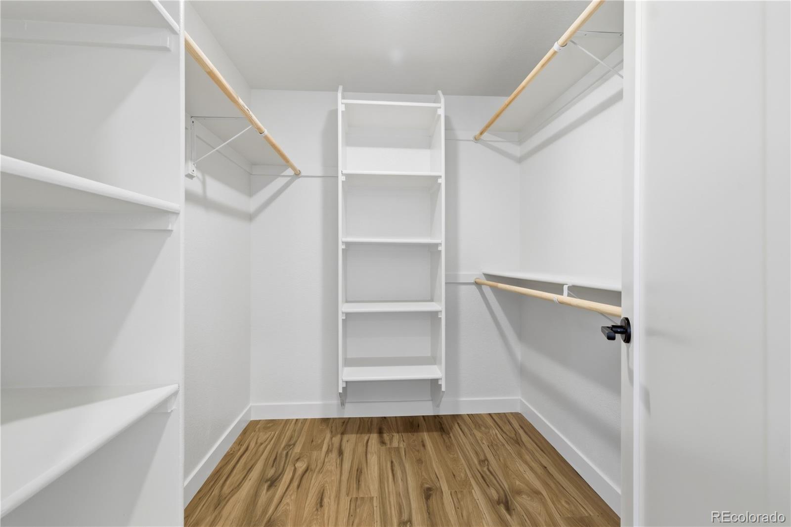 901 Garrison Street Lakewood, CO 80215 - Photo 13 of 47 a view of walk in closet with empty racks