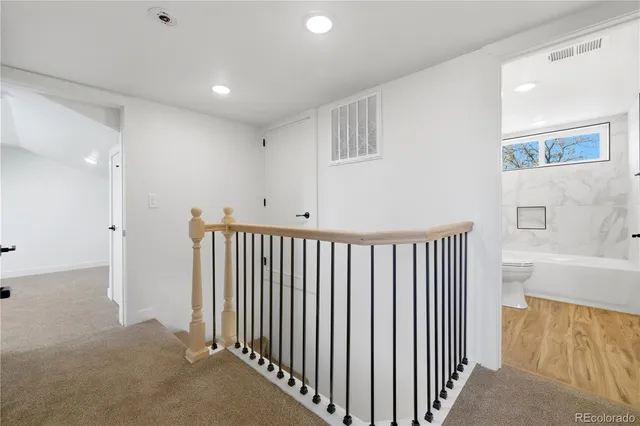 a view of a hallway with entryway door