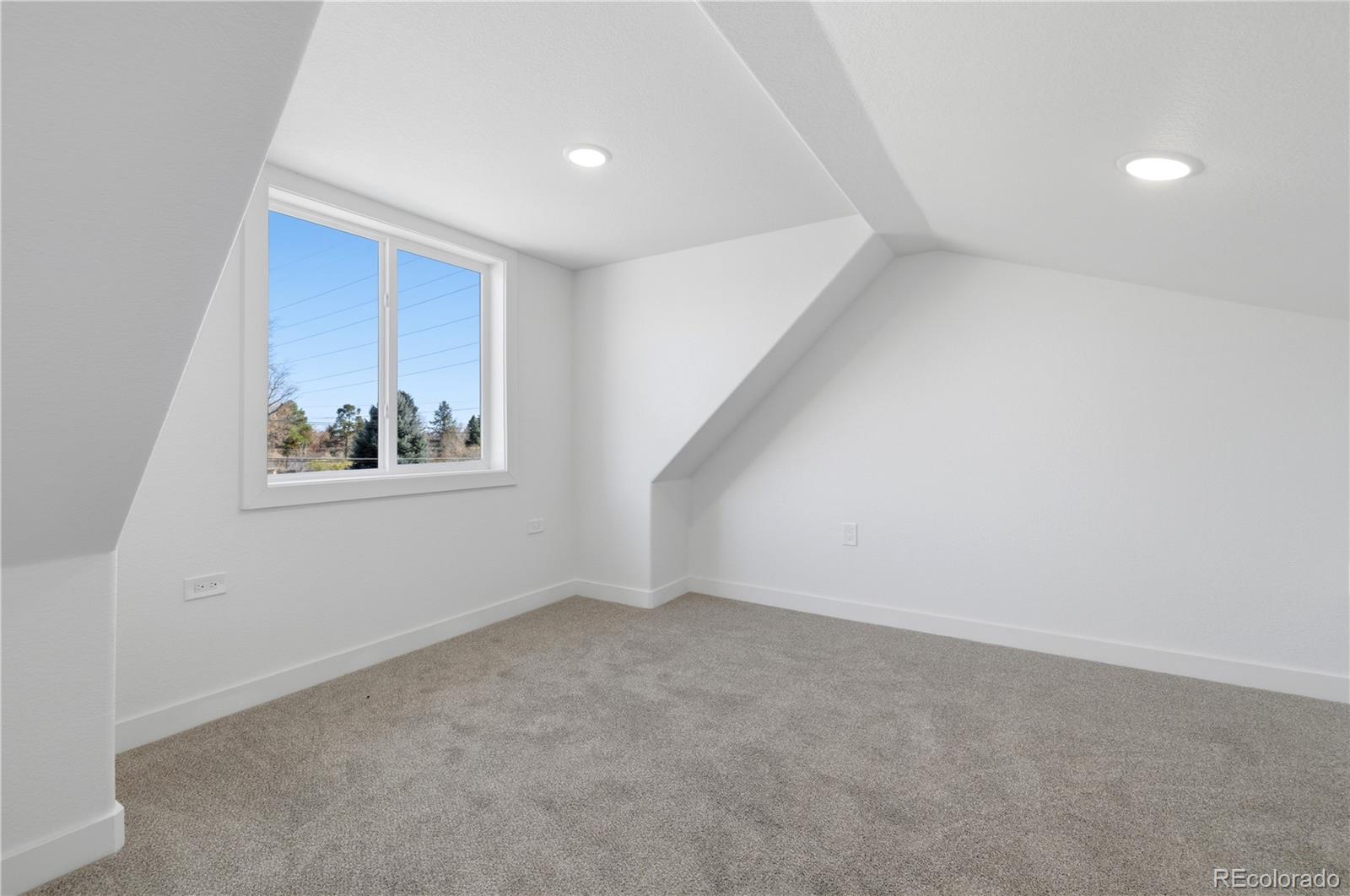 901 Garrison Street Lakewood, CO 80215 - Photo 18 of 47 an empty room with windows