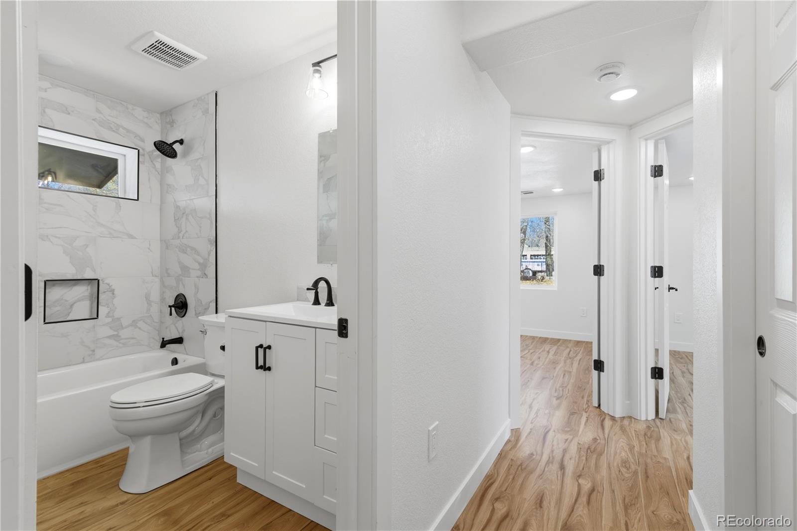 901 Garrison Street Lakewood, CO 80215 - Photo 35 of 47 a bathroom with a toilet and a shower