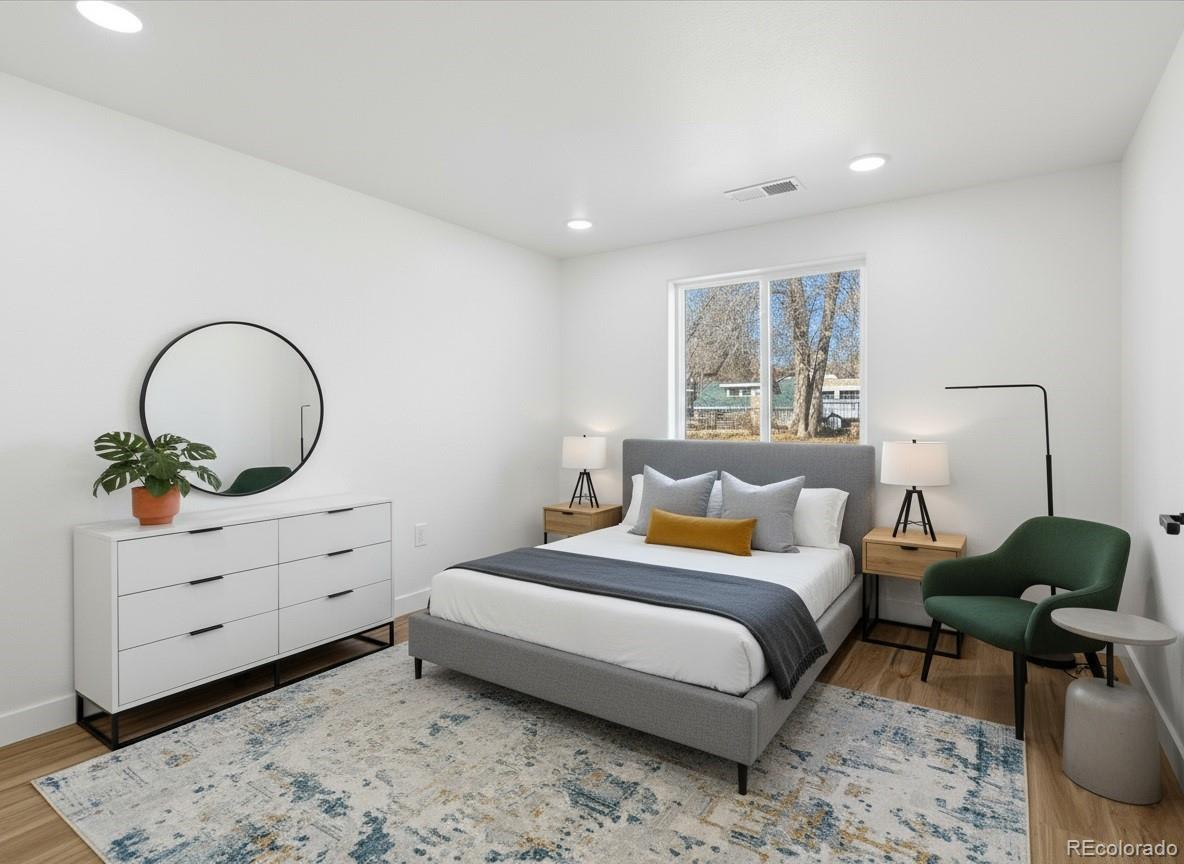 901 Garrison Street Lakewood, CO 80215 - Photo 37 of 47 a bedroom with a bed and a dresser