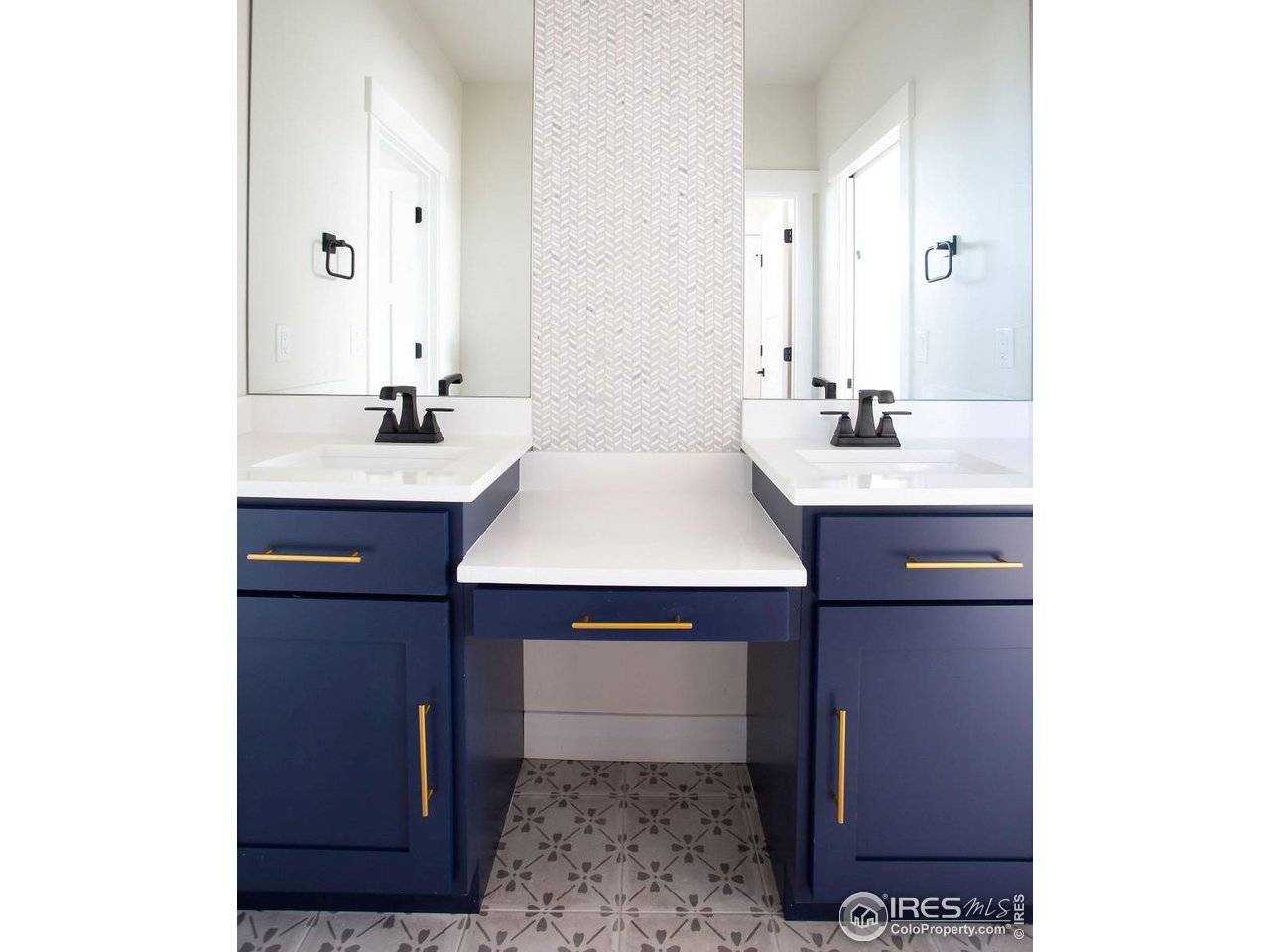 15261 Ypsilon Circle Mead, CO 80542 - Photo 14 of 15 a bathroom with a sink and a mirror