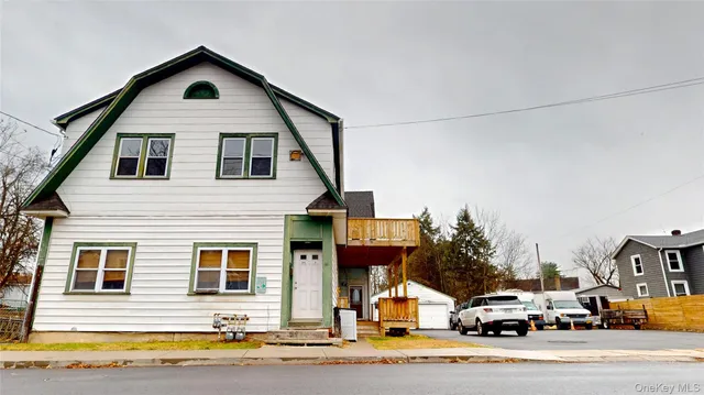 a view of a house with a street