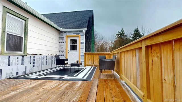 a balcony view with a backyard space