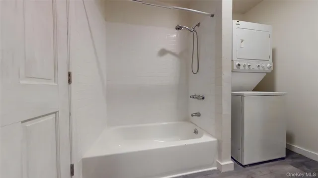 a bathroom with a tub and shower