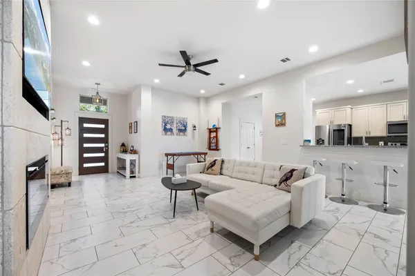 a living room with furniture and a flat screen tv