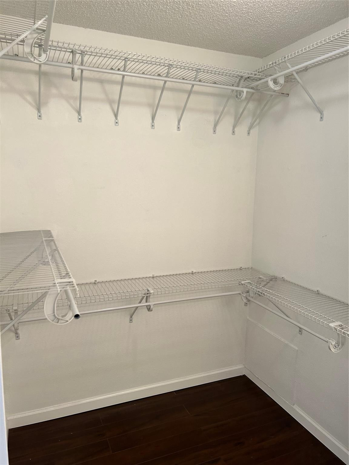 8117 Severn Drive, Unit C Boca Raton, FL 33433 - Photo 11 of 11 a view of a room with racks on the wall