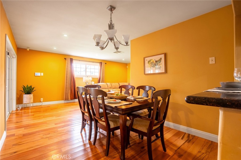 415 South Taper Avenue Compton, CA 90220 - Photo 11 of 32 a view of a dining room with furniture and wooden floor