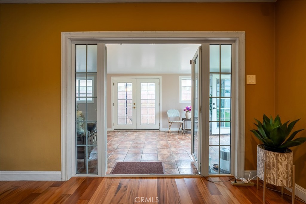 415 South Taper Avenue Compton, CA 90220 - Photo 21 of 32 a view of a hallway with wooden floor and a livingroom