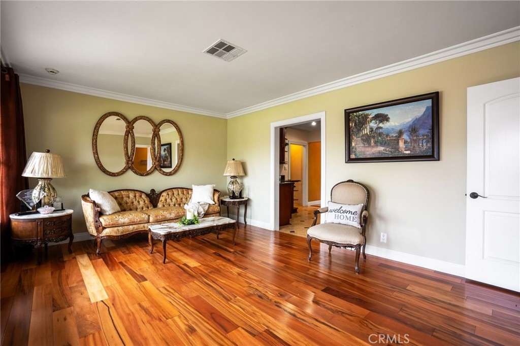 415 South Taper Avenue Compton, CA 90220 - Photo 4 of 32 a living room with furniture and a painting on the wall
