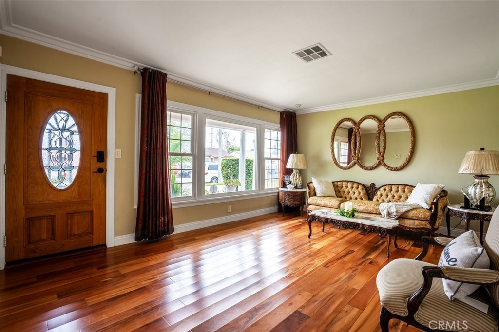415 South Taper Avenue Compton, CA 90220 - Photo 5 of 32 a living room with furniture and a large window