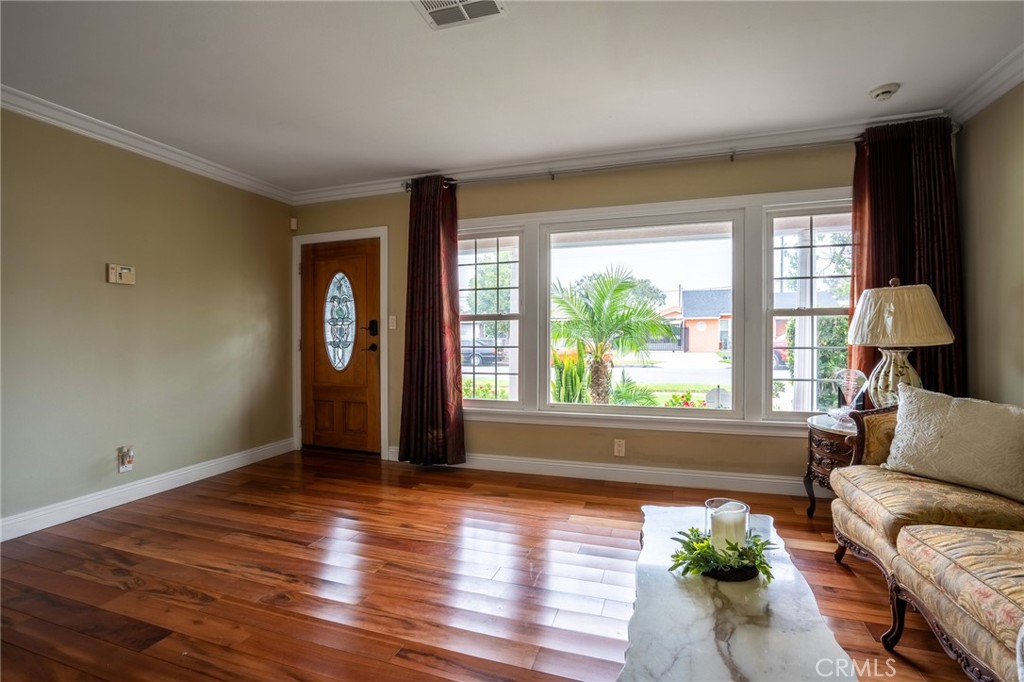 415 South Taper Avenue Compton, CA 90220 - Photo 7 of 32 a living room with furniture and a window
