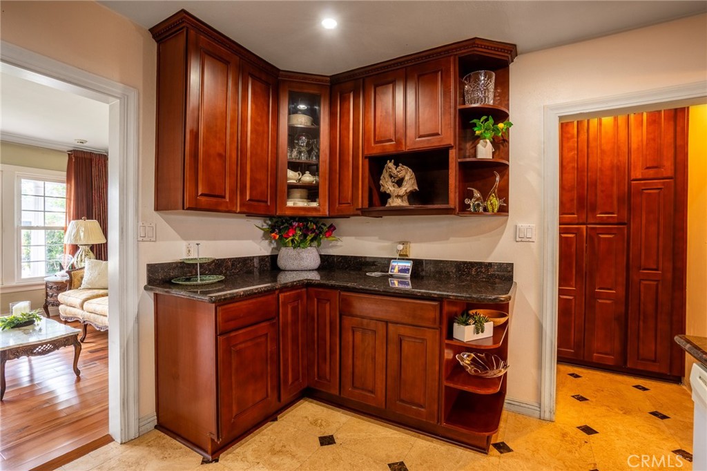 415 South Taper Avenue Compton, CA 90220 - Photo 9 of 32 a kitchen with stainless steel appliances granite countertop a stove a sink and a microwave