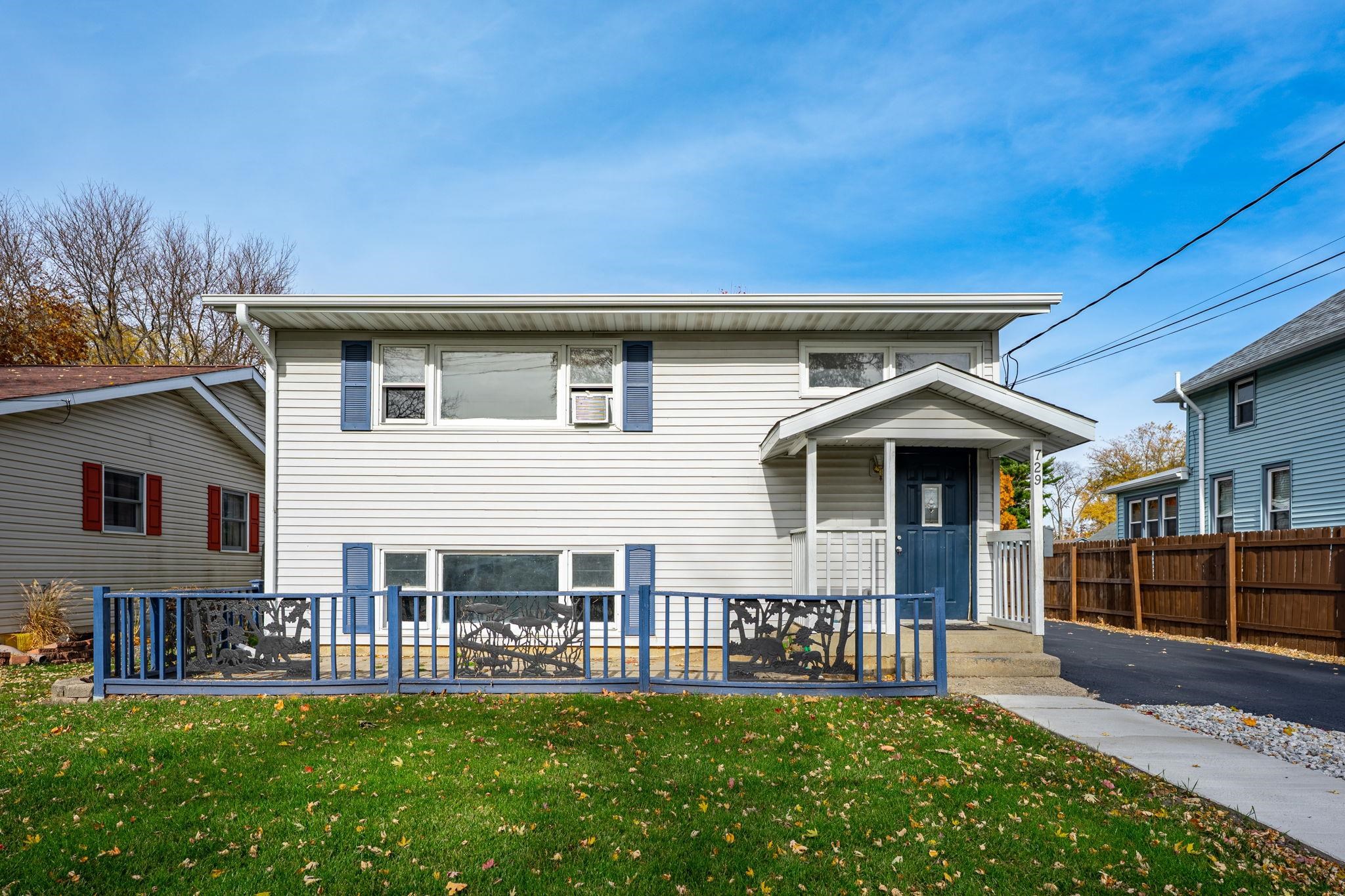 729 West Perry Street Belvidere, IL 61008 - Photo 1 of 27 a front view of a house with a garden