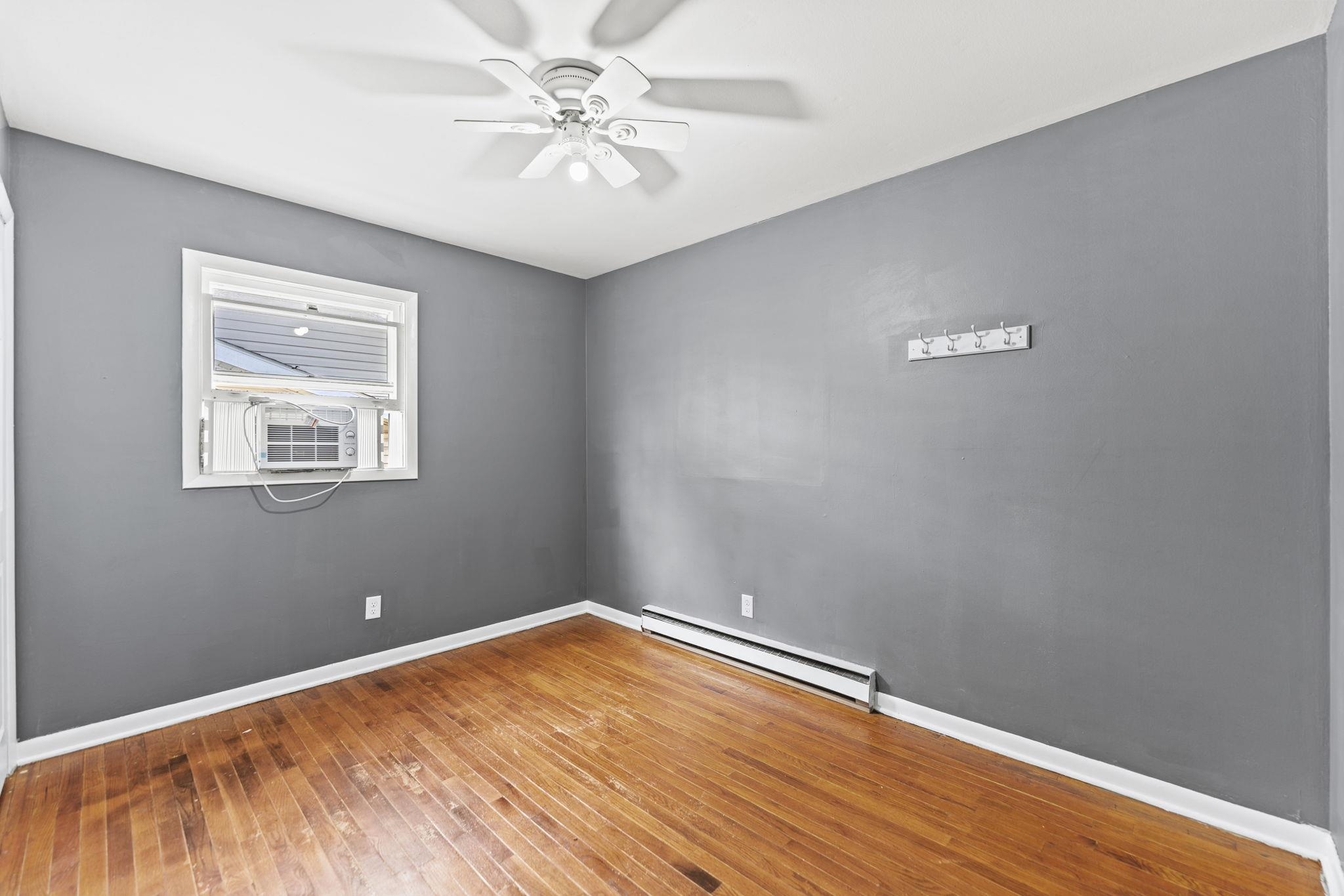729 West Perry Street Belvidere, IL 61008 - Photo 19 of 27 a view of a room with wooden floor and a window