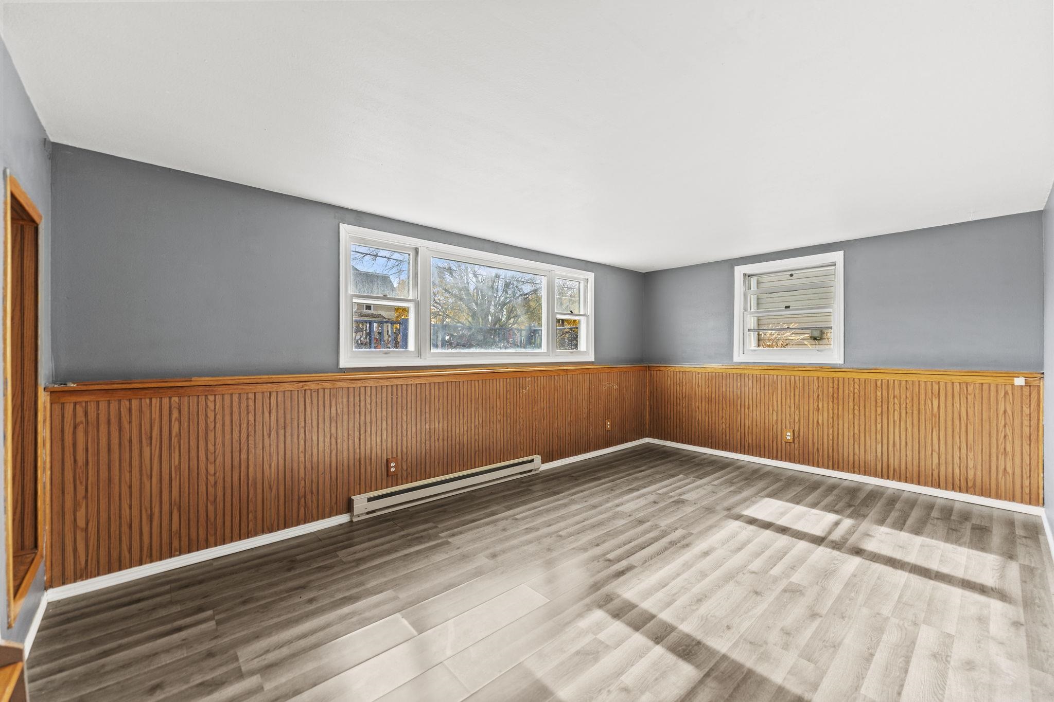 729 West Perry Street Belvidere, IL 61008 - Photo 8 of 27 a view of a room with wooden floor and white walls