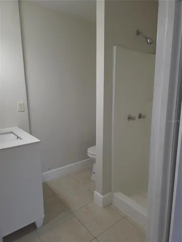 a bathroom with a granite countertop sink