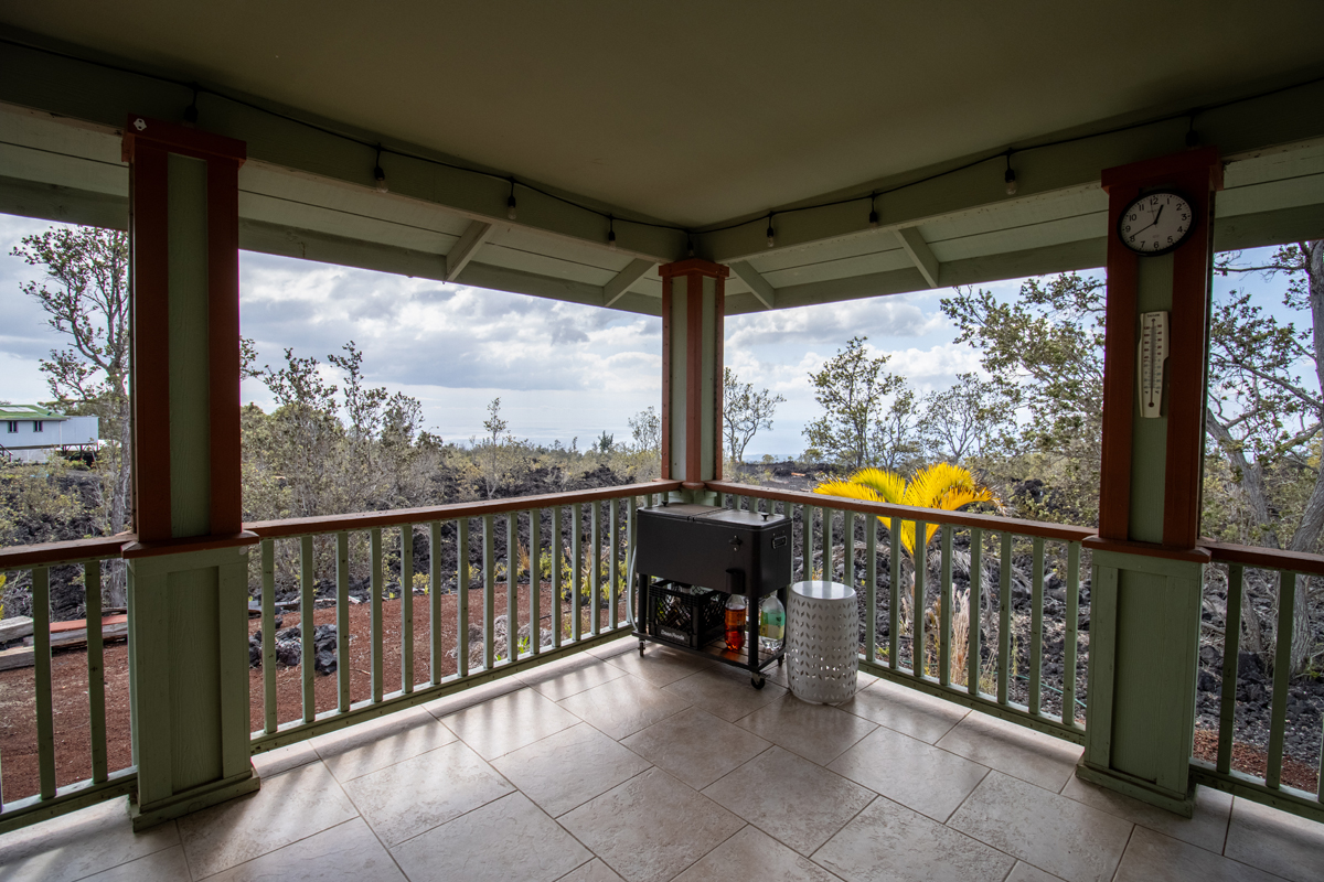 92-8901 Tiki Lane Ocean View, HI 96704 - Photo 12 of 24 a view of an outdoor space with a large window