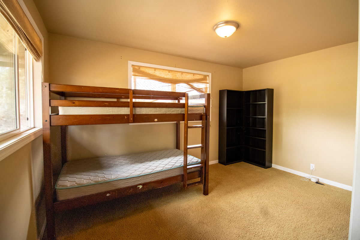 92-8901 Tiki Lane Ocean View, HI 96704 - Photo 16 of 24 a bedroom with window