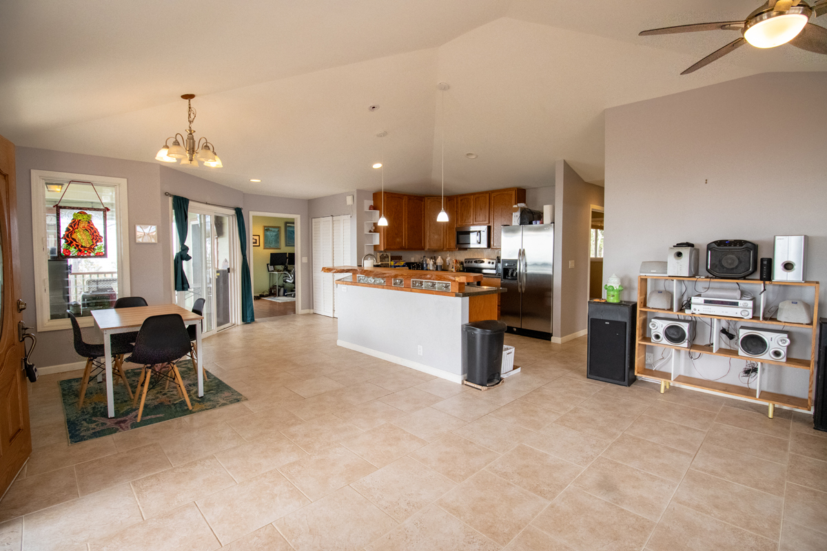 92-8901 Tiki Lane Ocean View, HI 96704 - Photo 20 of 24 a living room with furniture and a kitchen