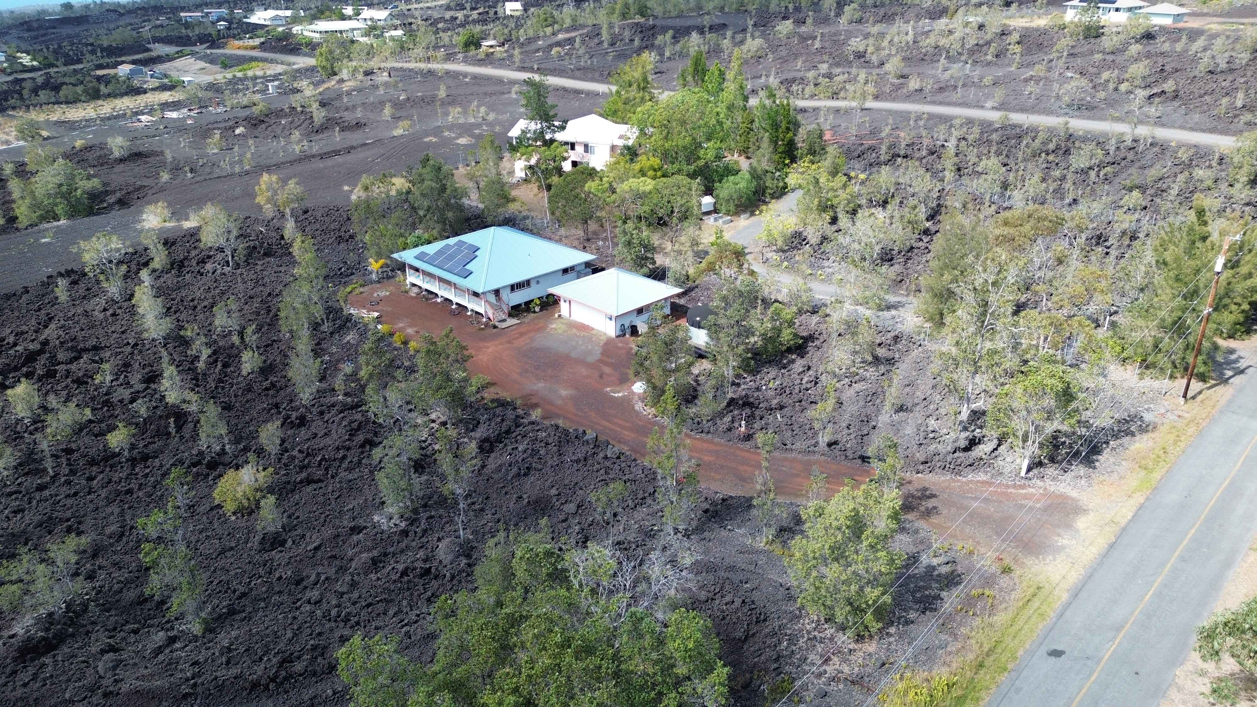 92-8901 Tiki Lane Ocean View, HI 96704 - Photo 2 of 24 an aerial view of a house with a yard