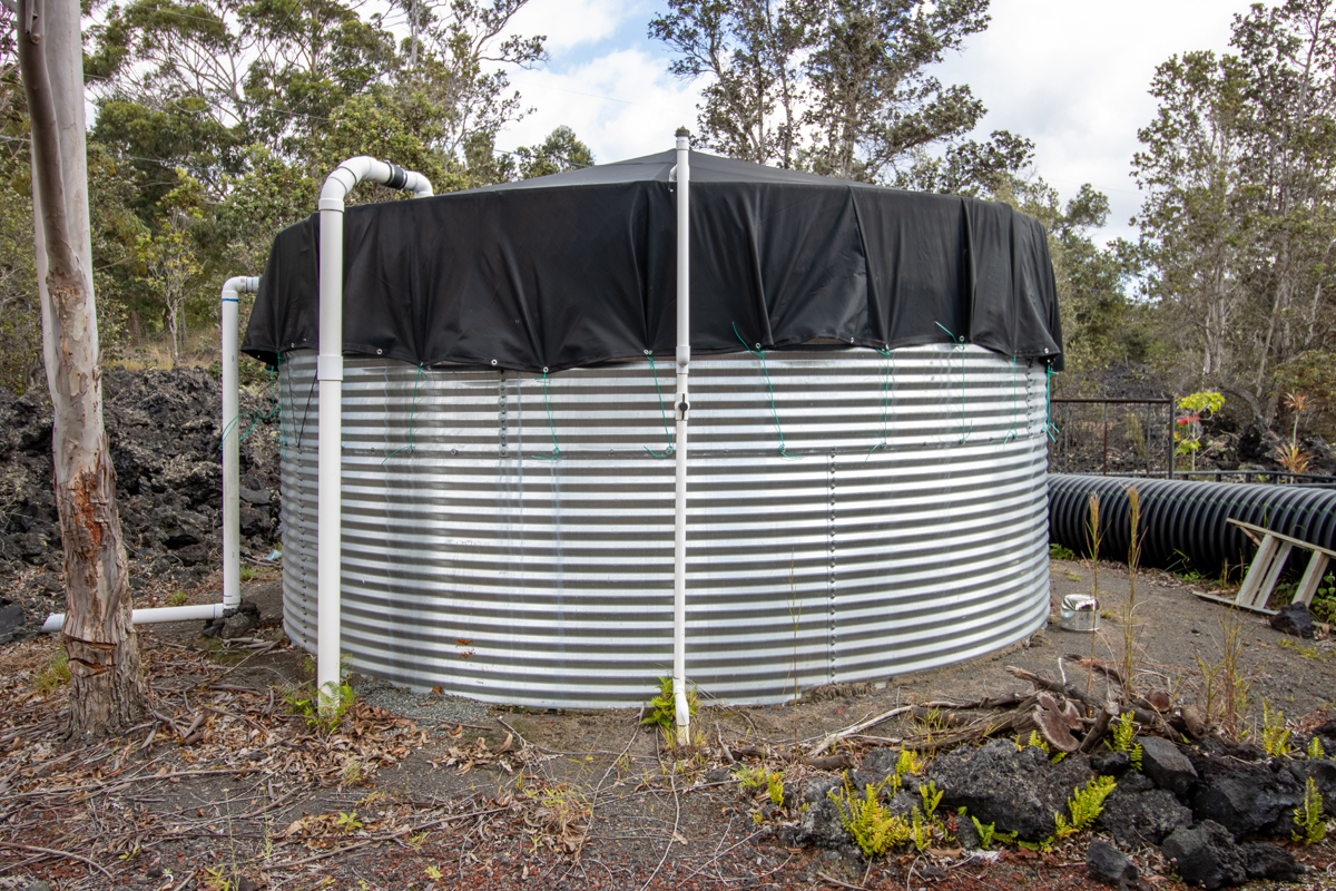 92-8901 Tiki Lane Ocean View, HI 96704 - Photo 21 of 24 a view of backyard with barbeque grill and wooden fence