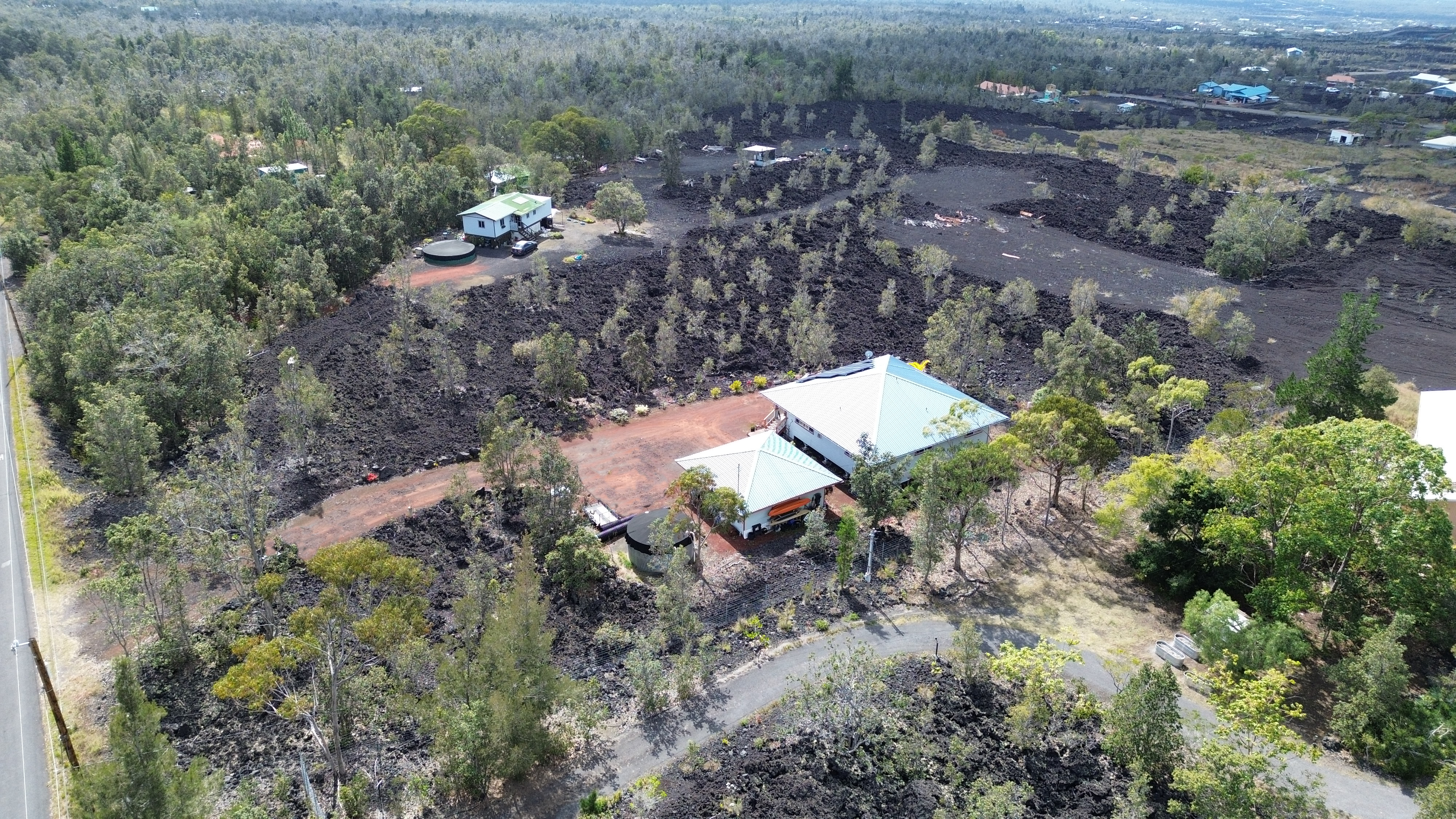 92-8901 Tiki Lane Ocean View, HI 96704 - Photo 3 of 24 an aerial view of a house with a yard