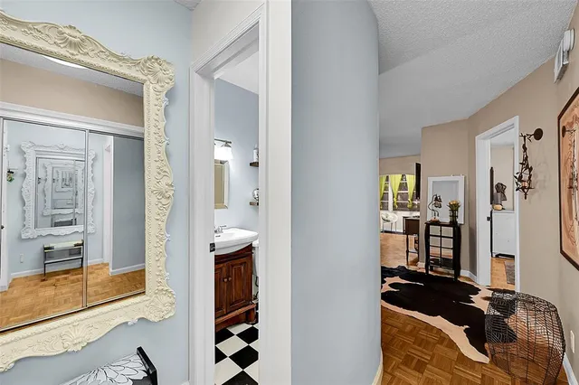 a view of walk in closet with living room