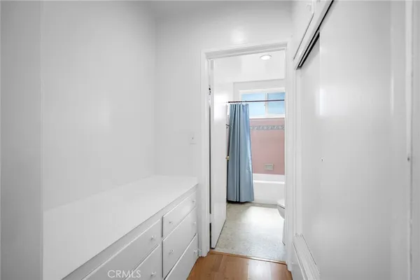 a view of hallway with wooden floor
