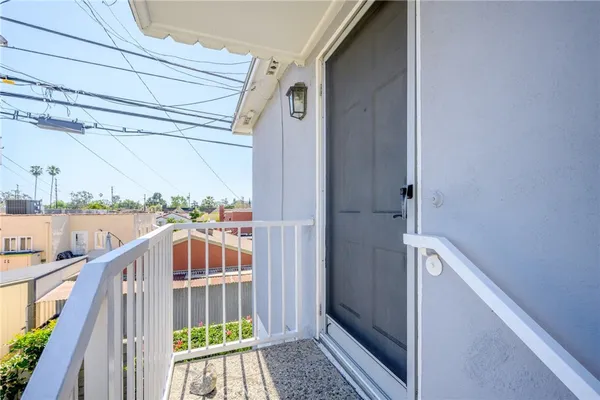 a view of balcony with furniture