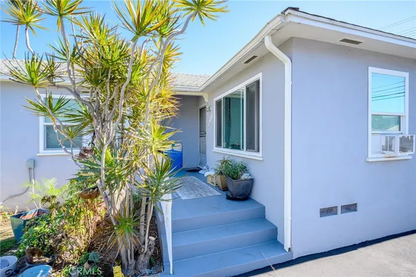 a front view of house with yard and outdoor seating