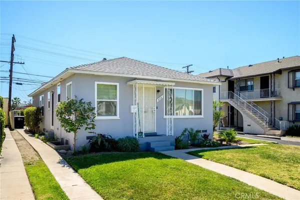 an aerial view of a house with a swimming pool