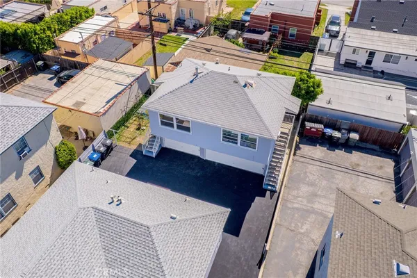 an aerial view of a houses with a lake view