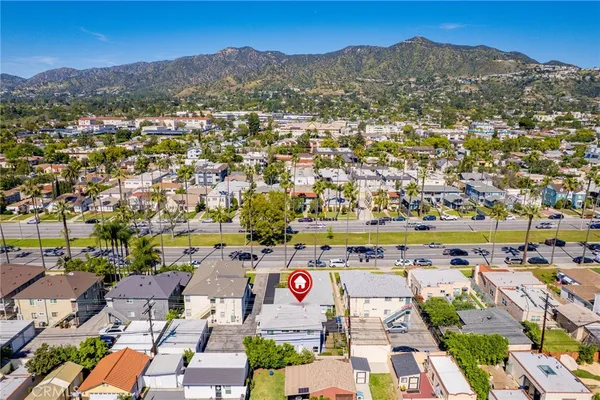 an aerial view of residential houses with outdoor space
