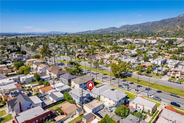 a view of a city with mountains in the background