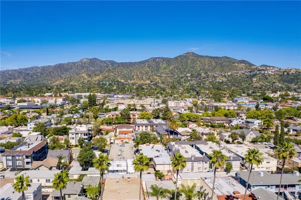 an aerial view of residential houses with outdoor space