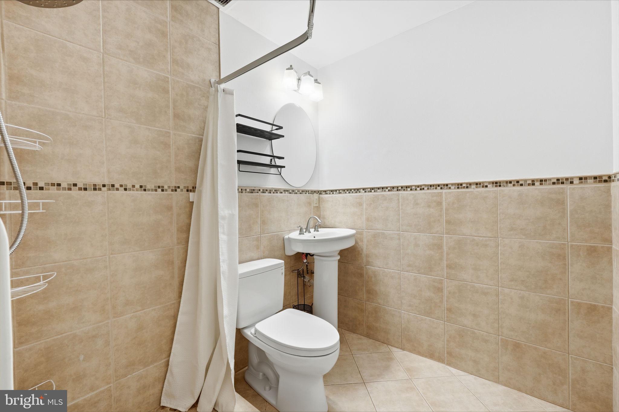 15010 Rolling Ridge Road Haymarket, VA 20169 - Photo 29 of 61 Modern bathroom with elegant tiles.