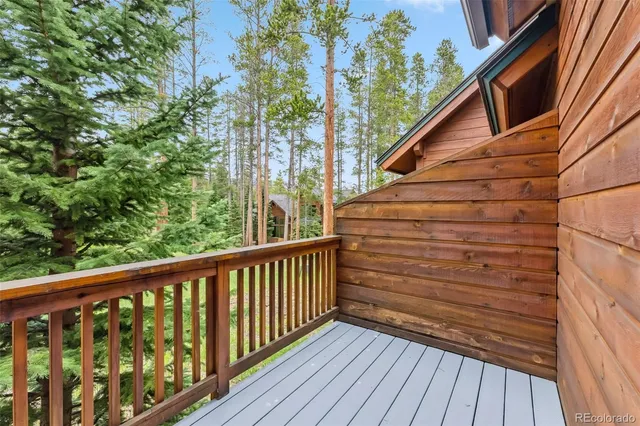 a view of a balcony with wooden floor