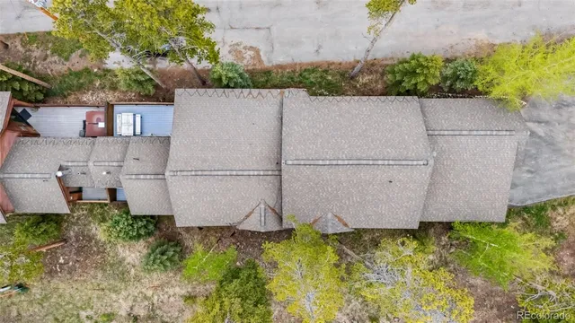 an aerial view of a house with a yard and garden