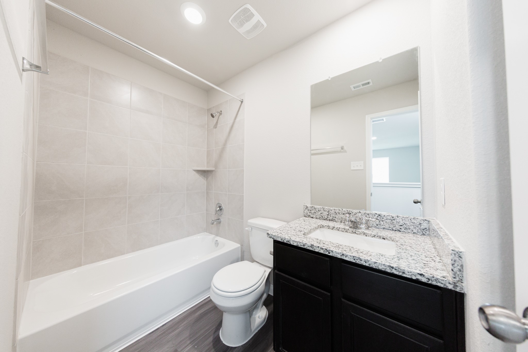 13687 Kit Run Splendora, TX 77372 - Photo 12 of 24 a bathroom with a granite countertop sink toilet and shower