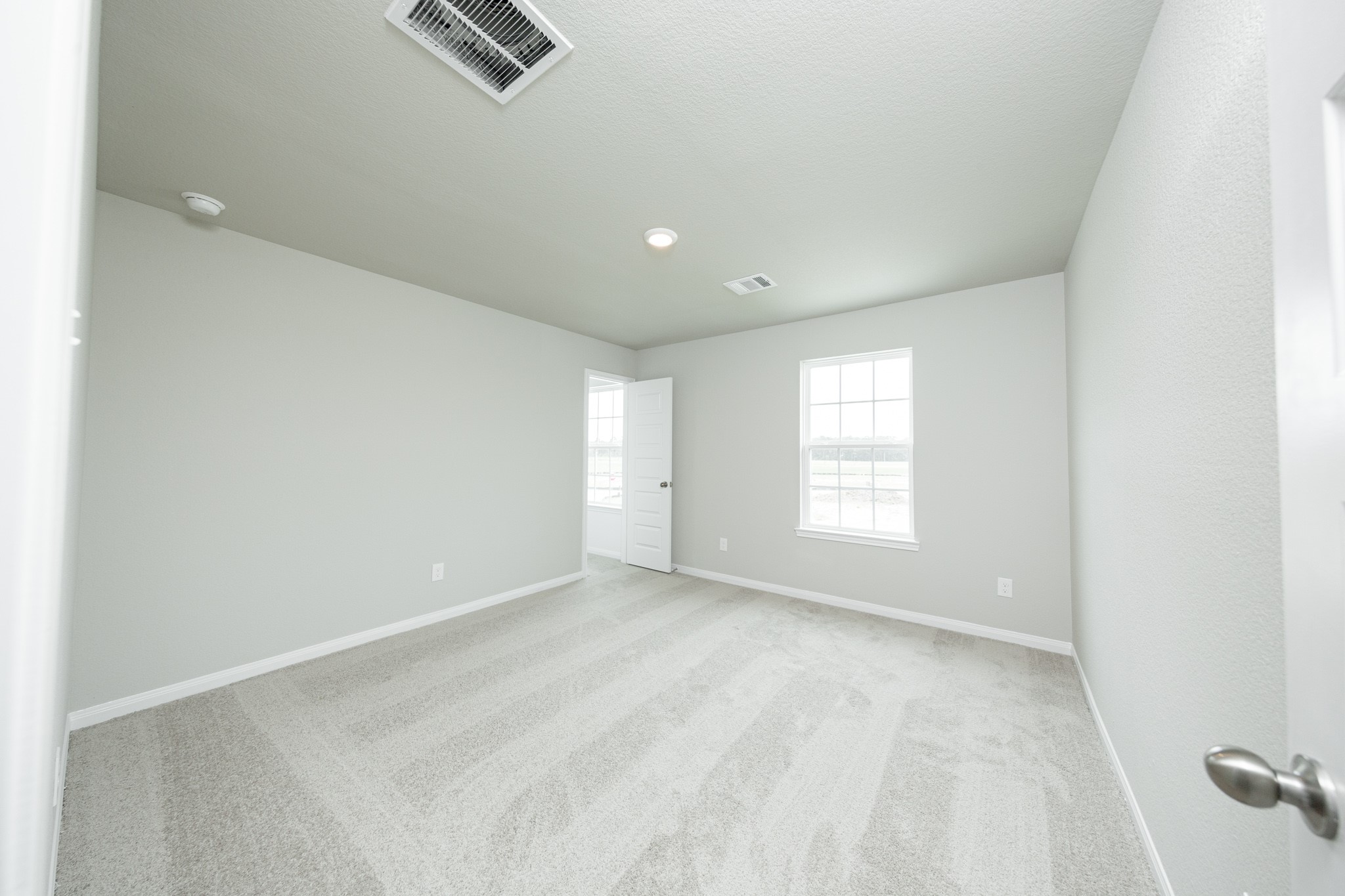 13687 Kit Run Splendora, TX 77372 - Photo 13 of 24 a view of empty room with windows