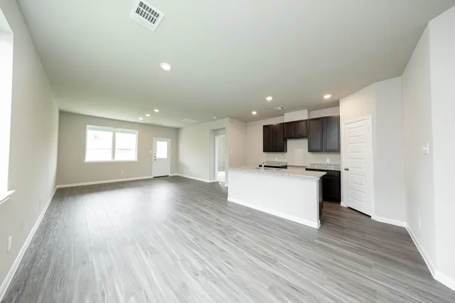 a view of kitchen with wooden floor and window