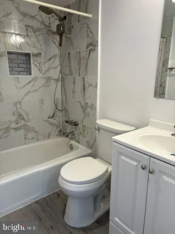 a bathroom with a shower and a toilet