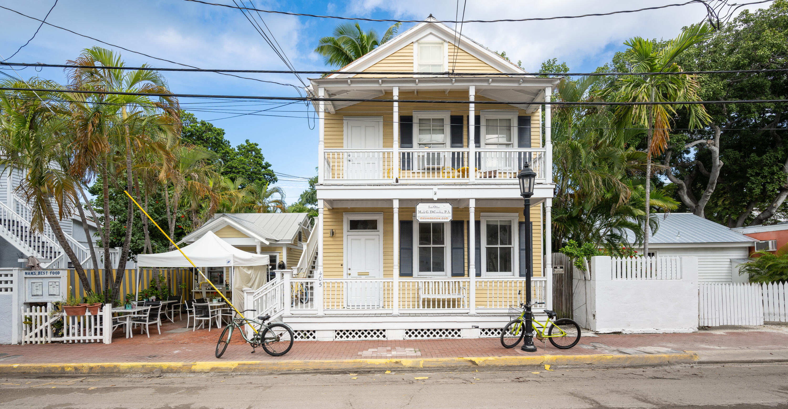 405 Petronia Street Key West, FL 33040 - Photo 3 of 47 a front view of a house with a garden